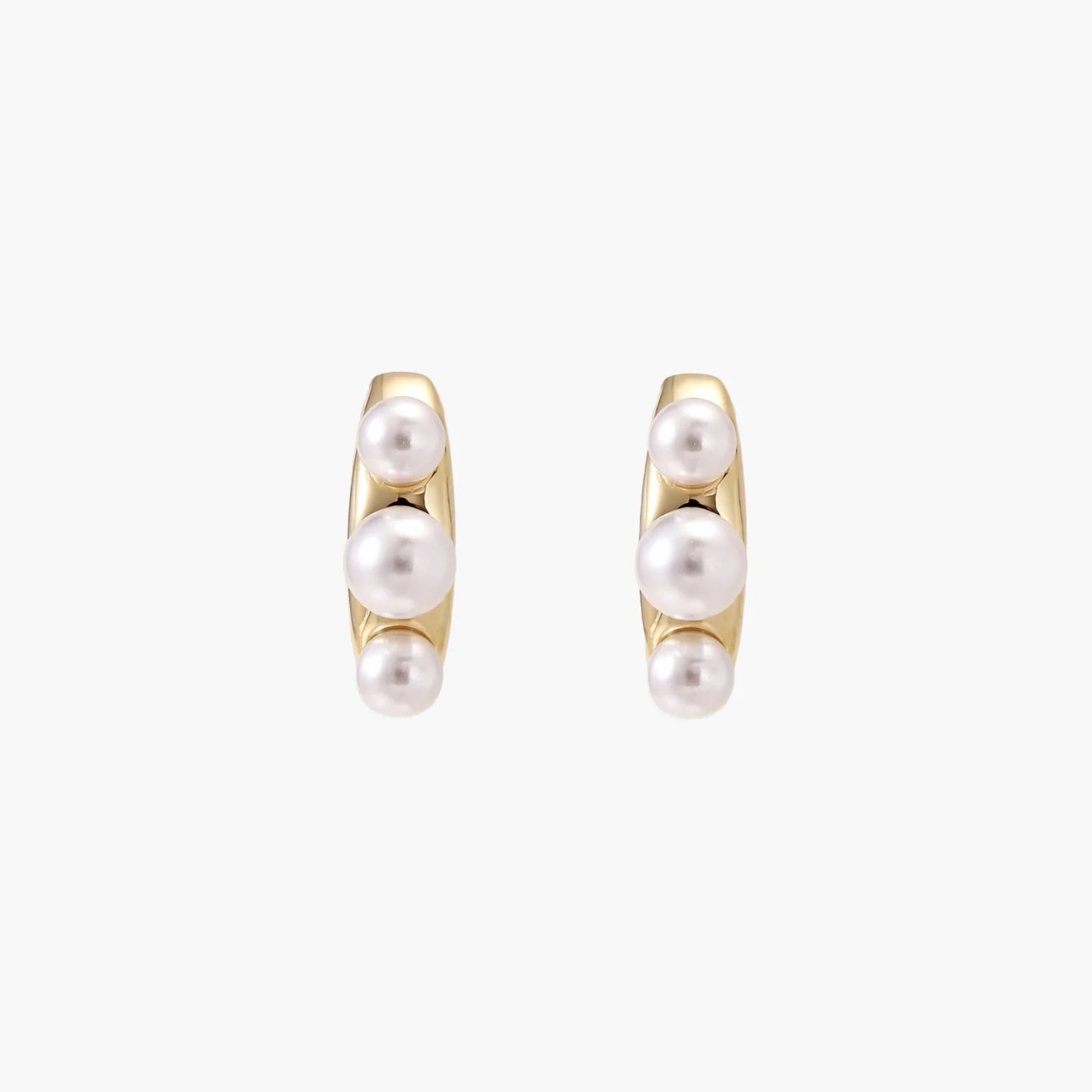 14K gold-plated curved stud earrings with three white freshwater pearls aligned vertically on cream background