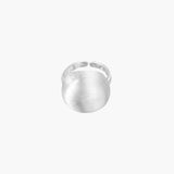 Minimalist brushed sterling silver dome ring with adjustable band on white background, front view.