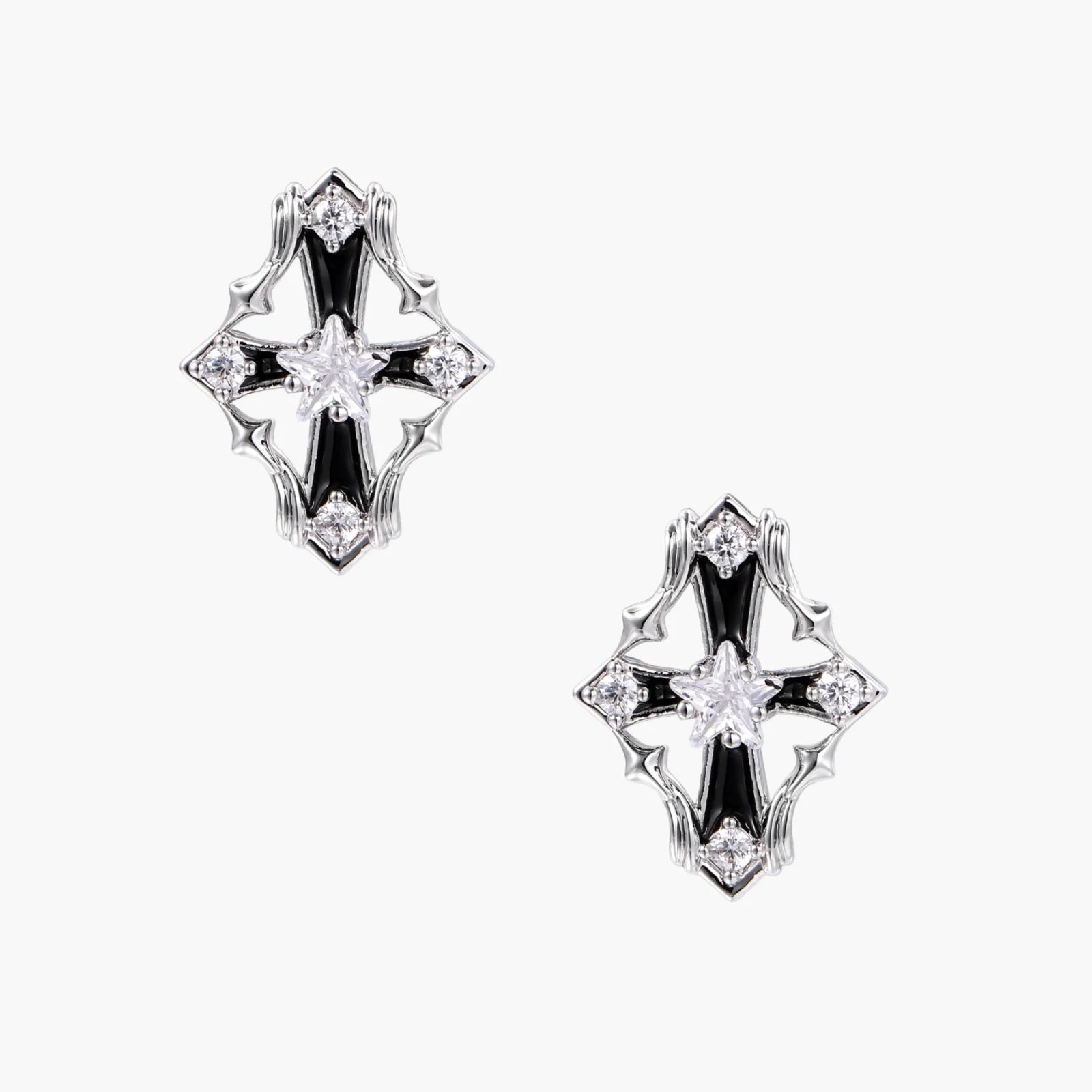 Pair of Art Deco-style stud earrings with star crystals, black enamel accents, and white gold plating on ivory background.