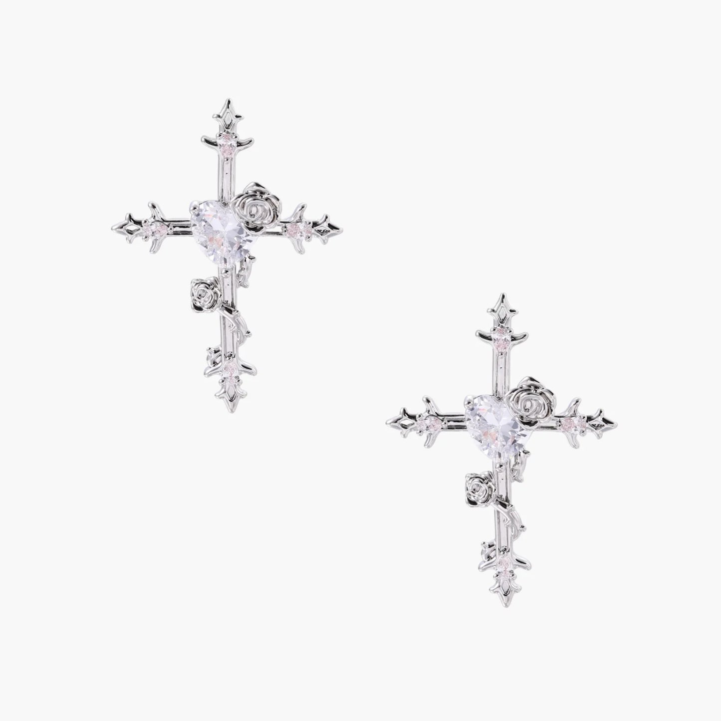 Two-tone cross earrings with gold roses and crystal stars on silver hoops, dangle drop style on white background.
