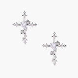 Two-tone cross earrings with gold roses and crystal stars on silver hoops, dangle drop style on white background.