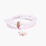 Double-wrap lavender beaded bracelet with rose quartz, pearls, gold vermeil charm and pink tassel on white background.