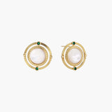 Circular gold stud earrings with iridescent mother-of-pearl center and green zirconia accents on cream background.