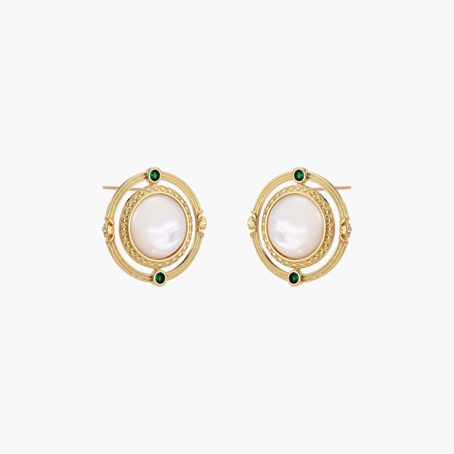 Circular gold stud earrings with iridescent mother-of-pearl center and green zirconia accents on cream background.