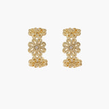Gold hoop earrings with intricate three-dimensional floral filigree pattern in 14K gold plated brass on cream background
