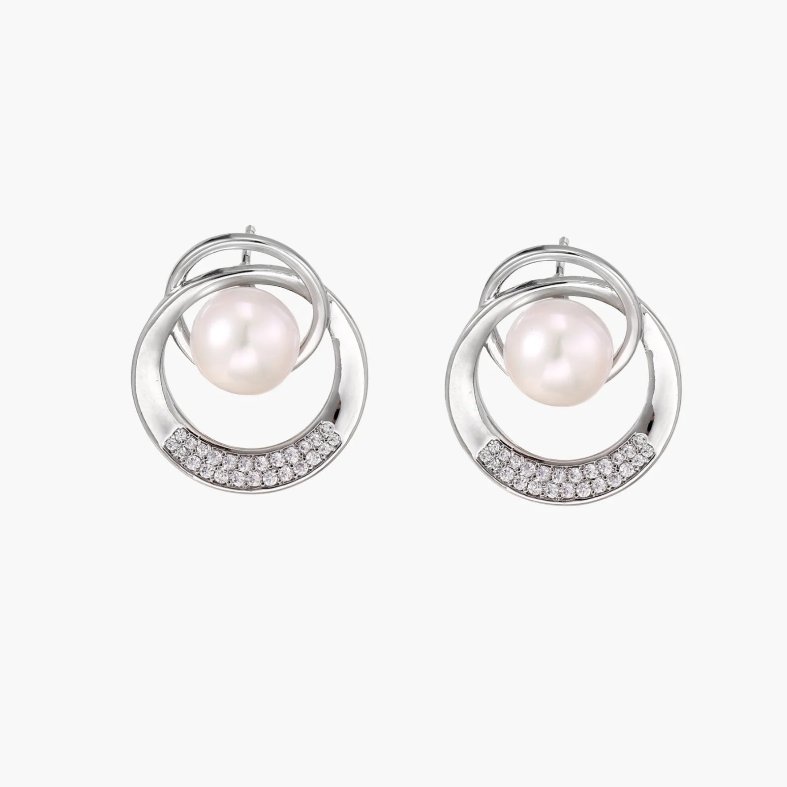 White gold-plated brass earrings with circular design, freshwater pearl center, and diamond accents