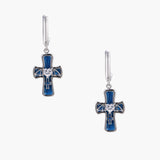 Silver huggie earrings with blue enamel cross charms featuring bat wings and heart-shaped crystal center