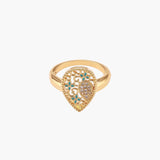 Teardrop-shaped gold-plated ring with turquoise enamel flowers and crystal pavé detail on cream background