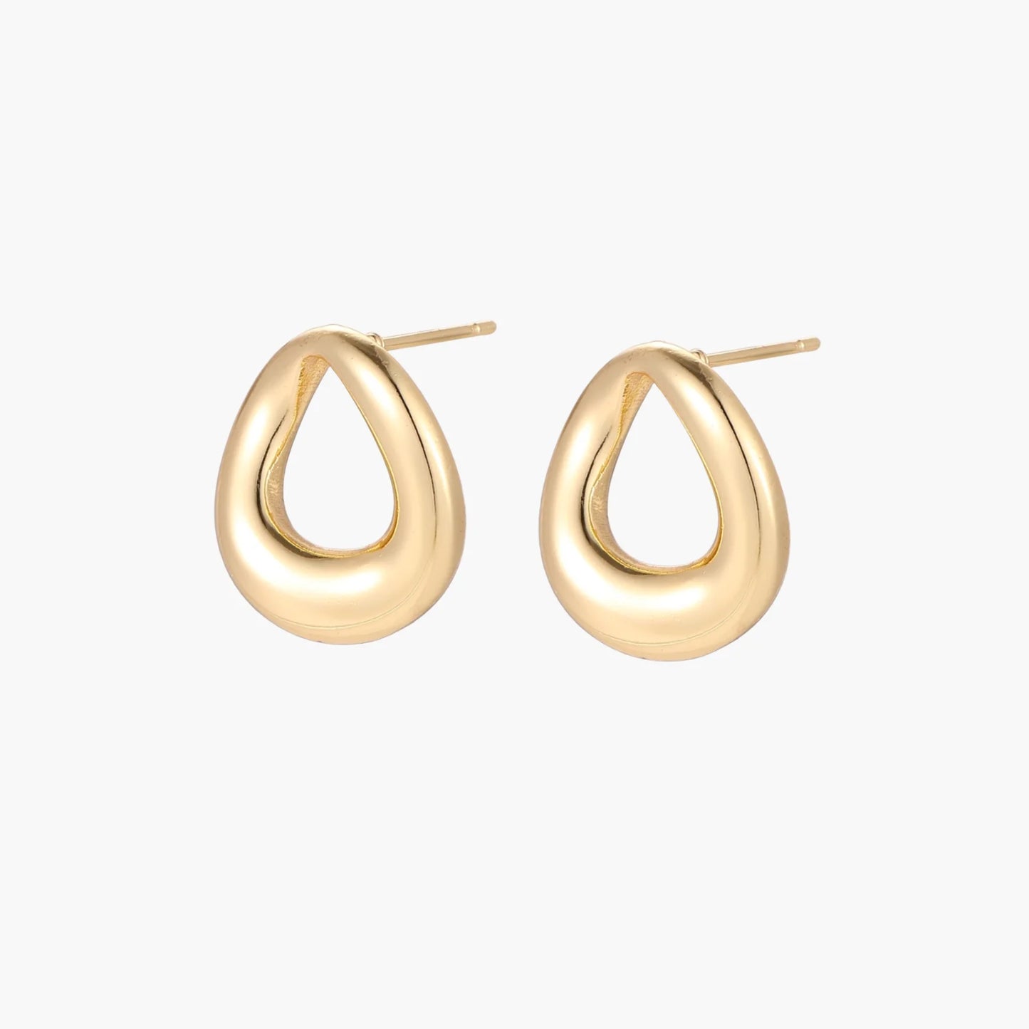 Pair of polished 18K gold-plated stainless steel teardrop earrings with hollow centers on cream background