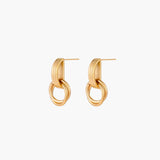 Gold stud earrings with vertical ridged bar connecting to triple interlocking circular rings on white background