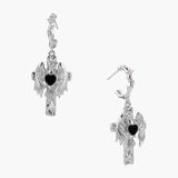 Silver drop earrings with twisted hoops and angel wings embracing black heart locket on white background.