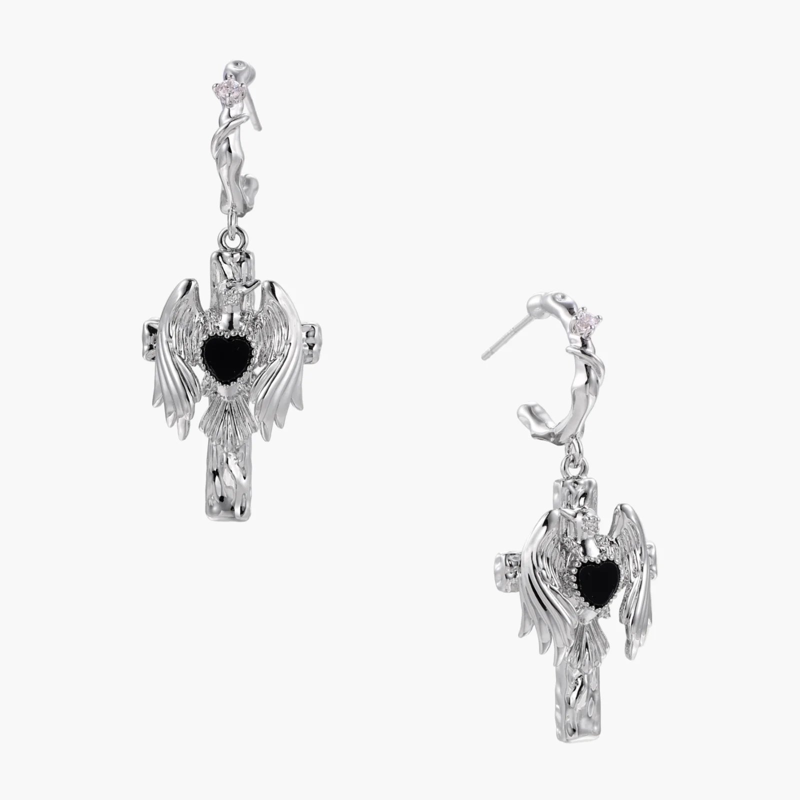 Silver drop earrings with twisted hoops and angel wings embracing black heart locket on white background.