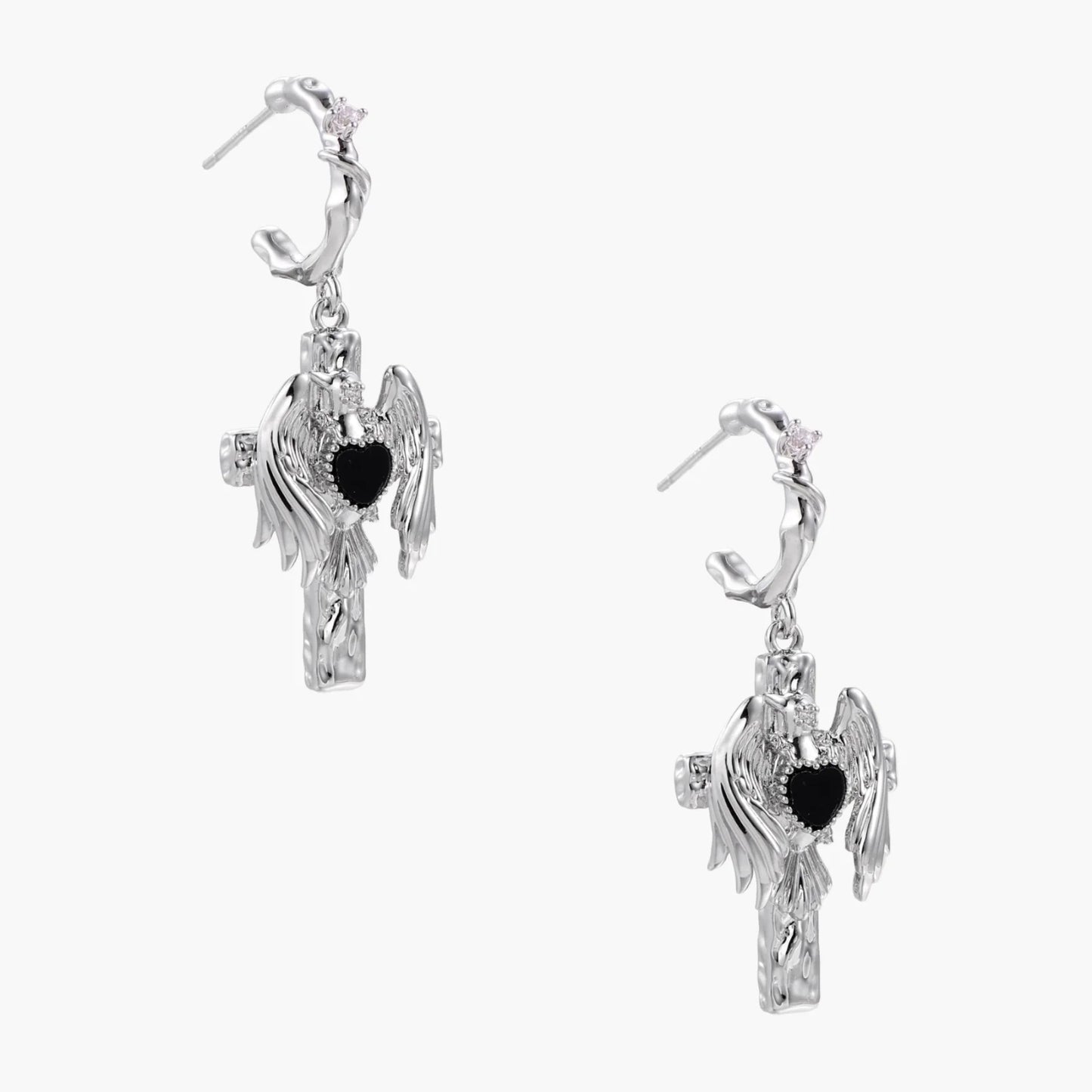 Silver drop earrings with twisted hoops and angel wings embracing black heart locket on white background.