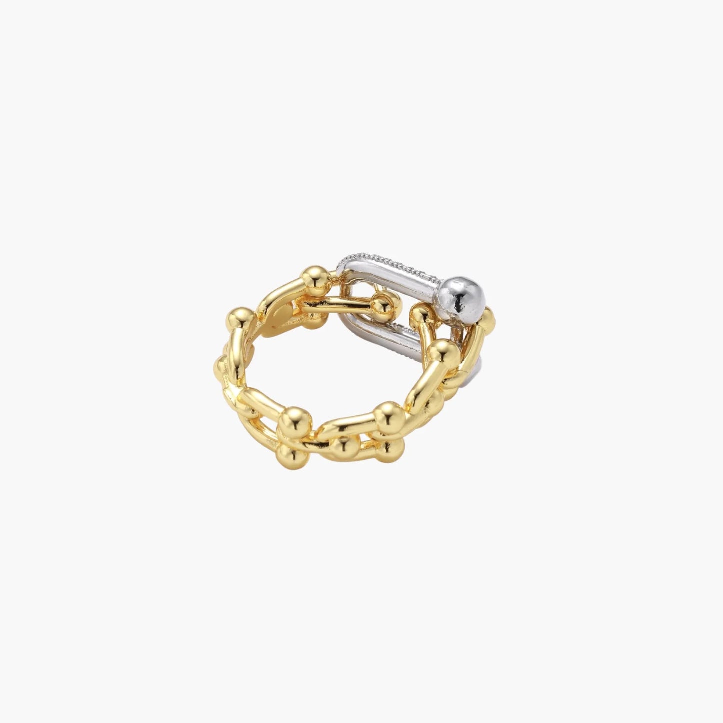 Triple-band gold ring with spherical bead chains and two crystal-pavé bars on cream background