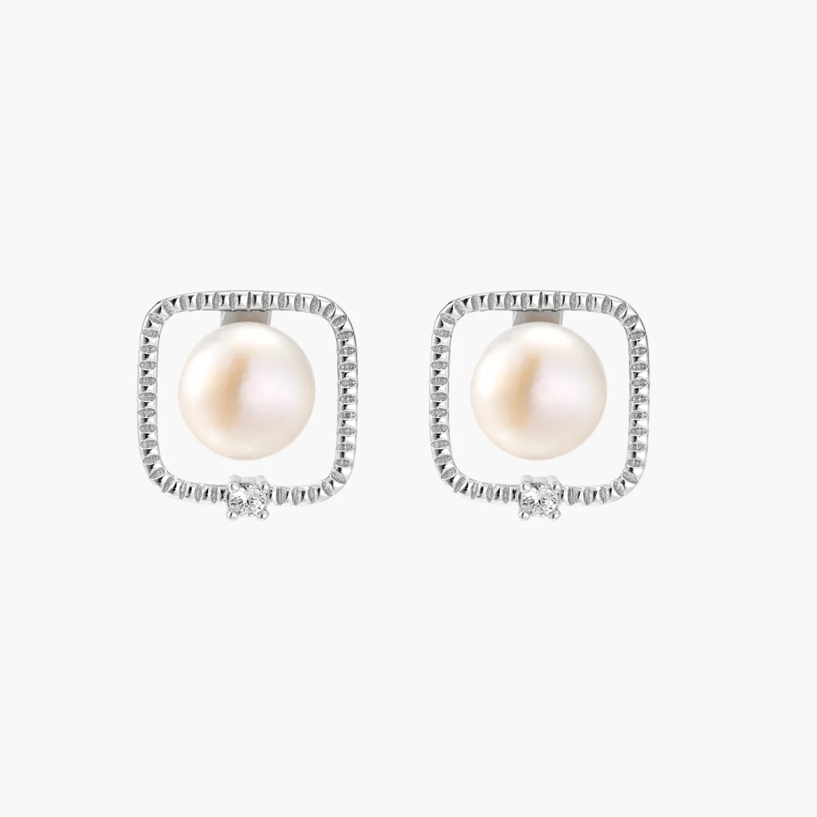 Rhodium-plated silver stud earrings with cushion frame, centered freshwater pearl, and tiny crystal accent