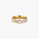 Gold-plated double-band ring with center rhinestone solitaire and channel-set stones on white background
