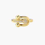 Gold-plated brass ring with safety pin design featuring pavé cubic zirconia stones and dual sphere ends