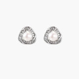 Triangular white gold plated stud earrings with central freshwater pearl and baguette-cut stones on white background