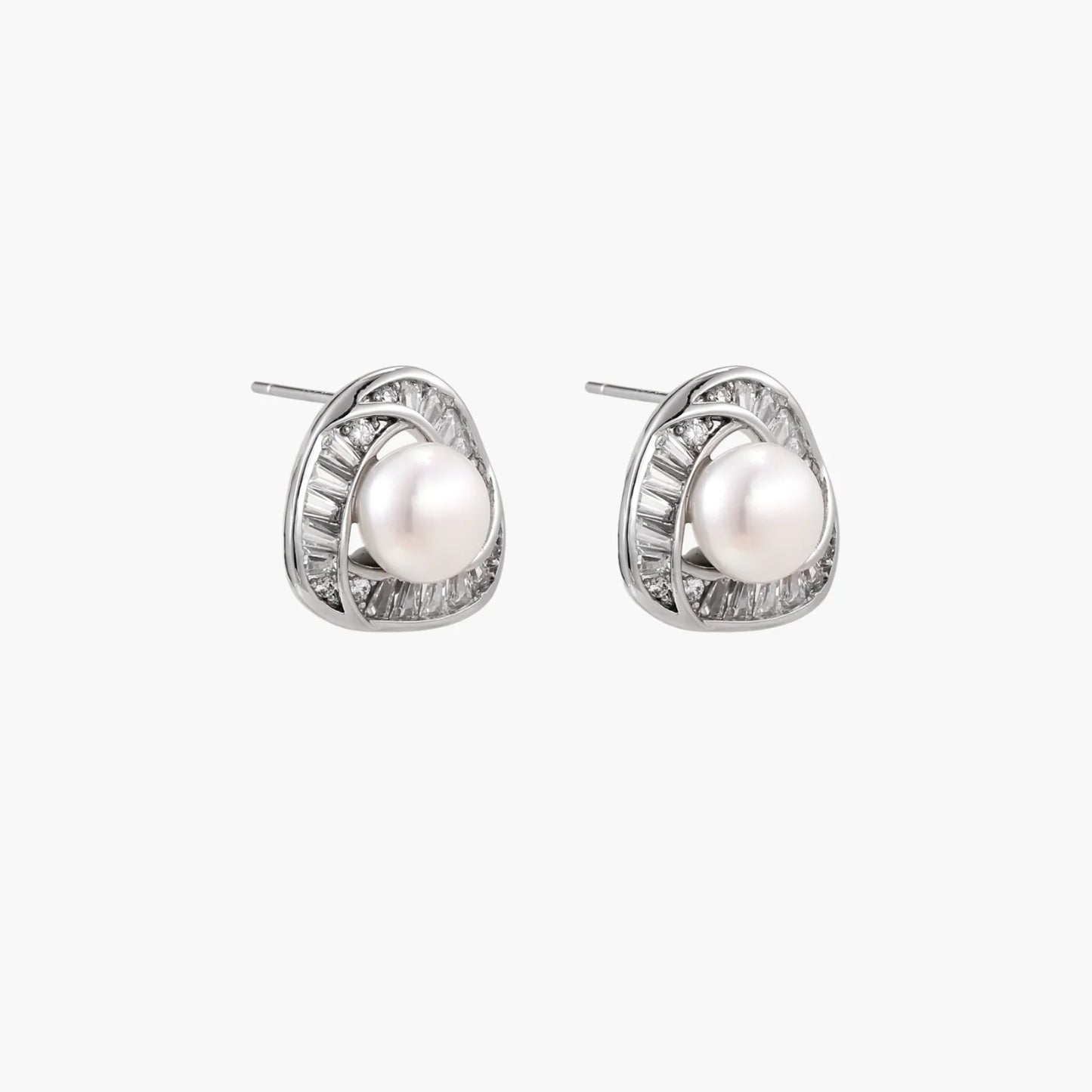Triangular white gold plated stud earrings with central freshwater pearl and baguette-cut stones on white background