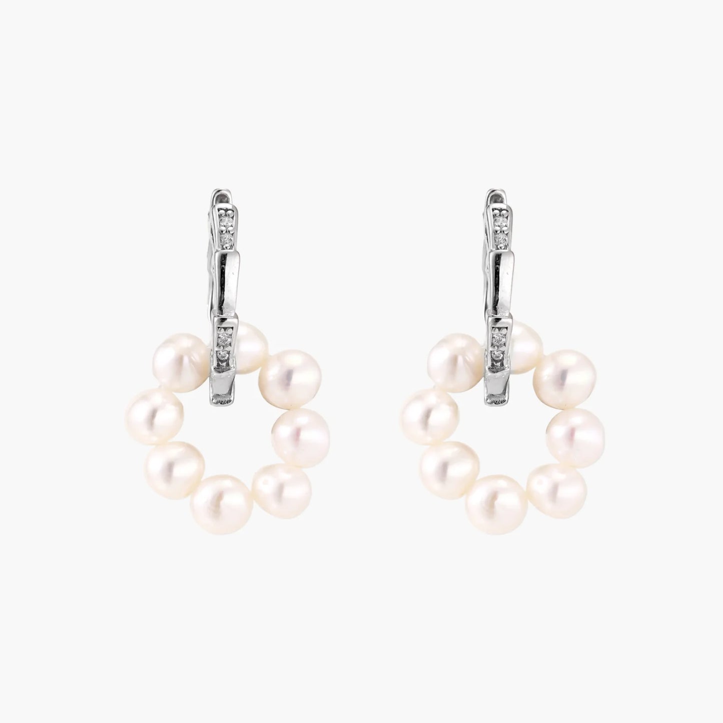 Rhodium-plated silver hoop earrings with freshwater pearls arranged in crescent formation and diamond accents