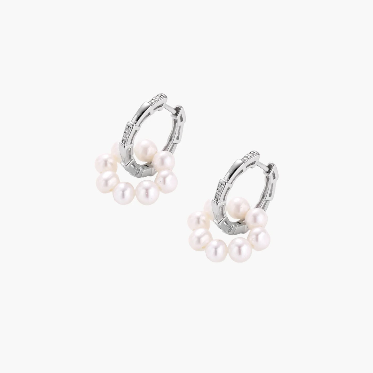 Rhodium-plated silver hoop earrings with freshwater pearls arranged in crescent formation and diamond accents