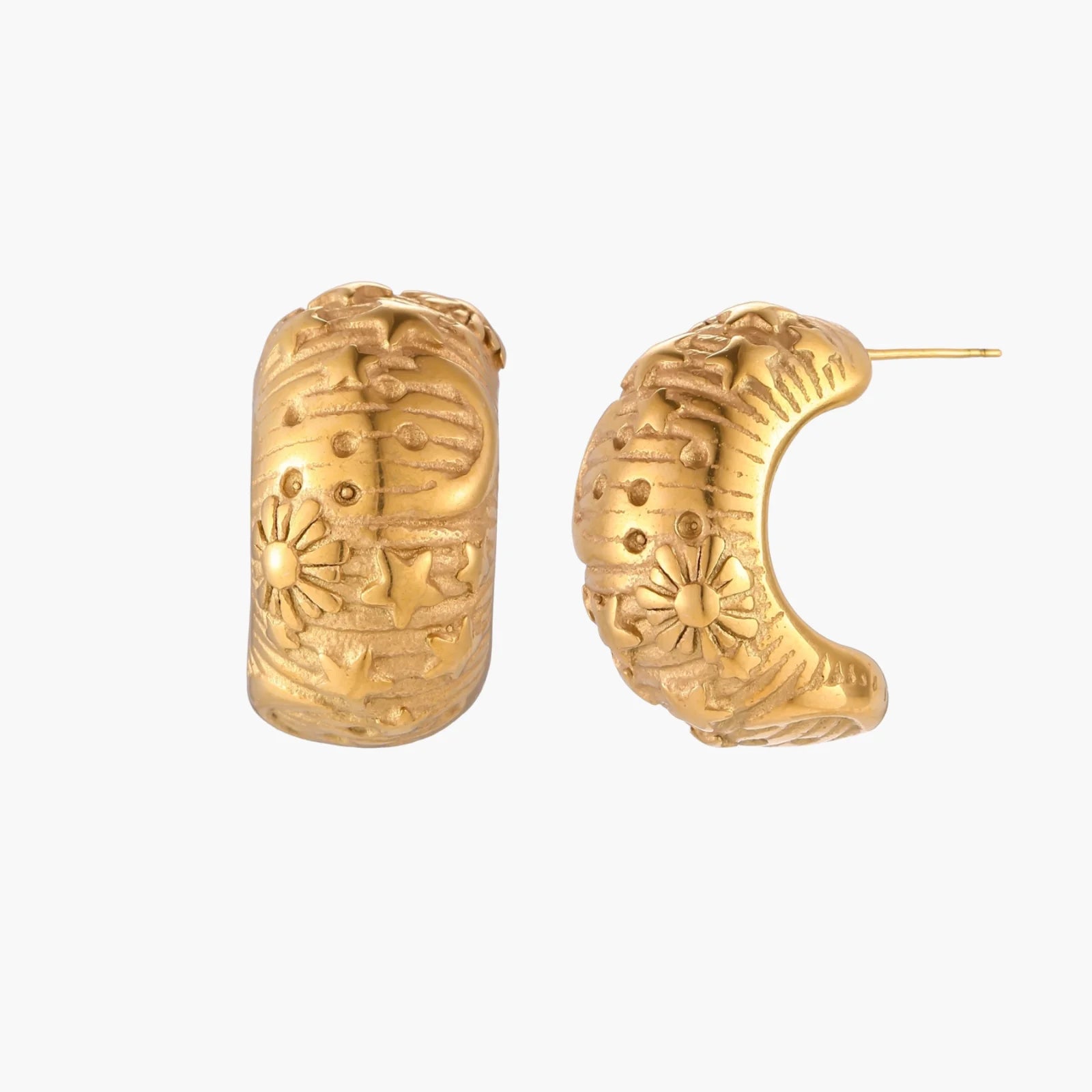 Gold-plated chunky hoop earrings with sun and star engravings on white background, showing detailed celestial pattern work.