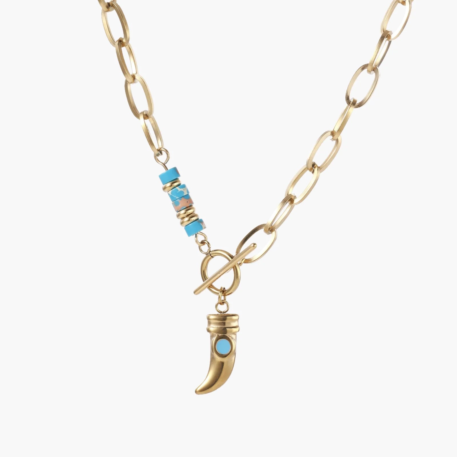 Gold chunky chain necklace with turquoise beaded accent and horn pendant on white background