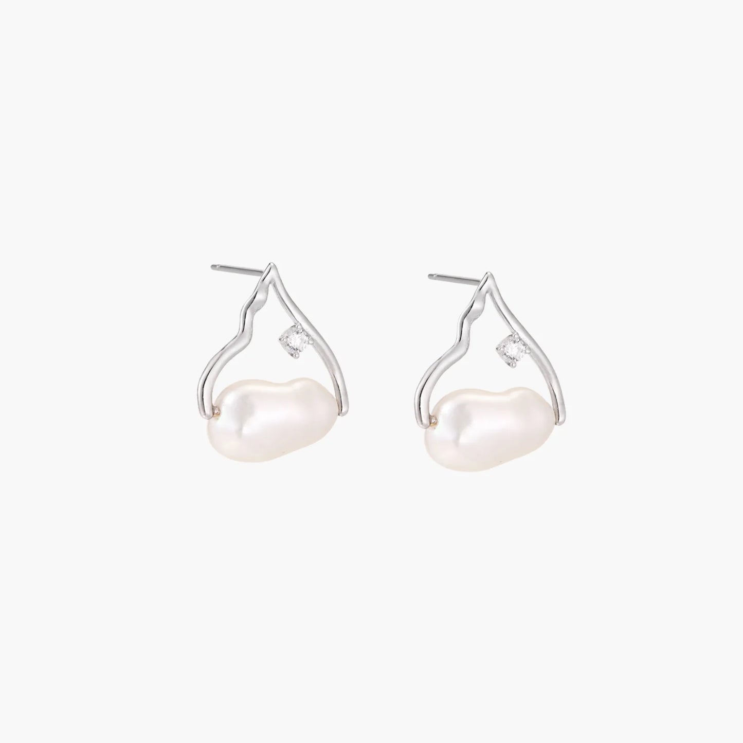Silver mountain outline studs with baroque pearl and diamond accent on white background
