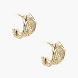 Gold-plated sculptural hoop earrings with geometric lattice centerband and sparkling zirconia on white background.
