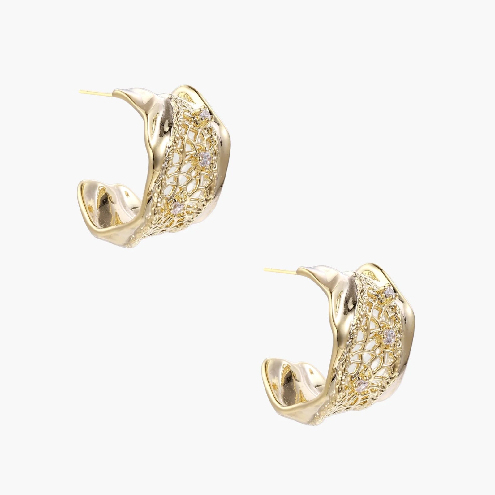 Gold-plated sculptural hoop earrings with geometric lattice centerband and sparkling zirconia on white background.