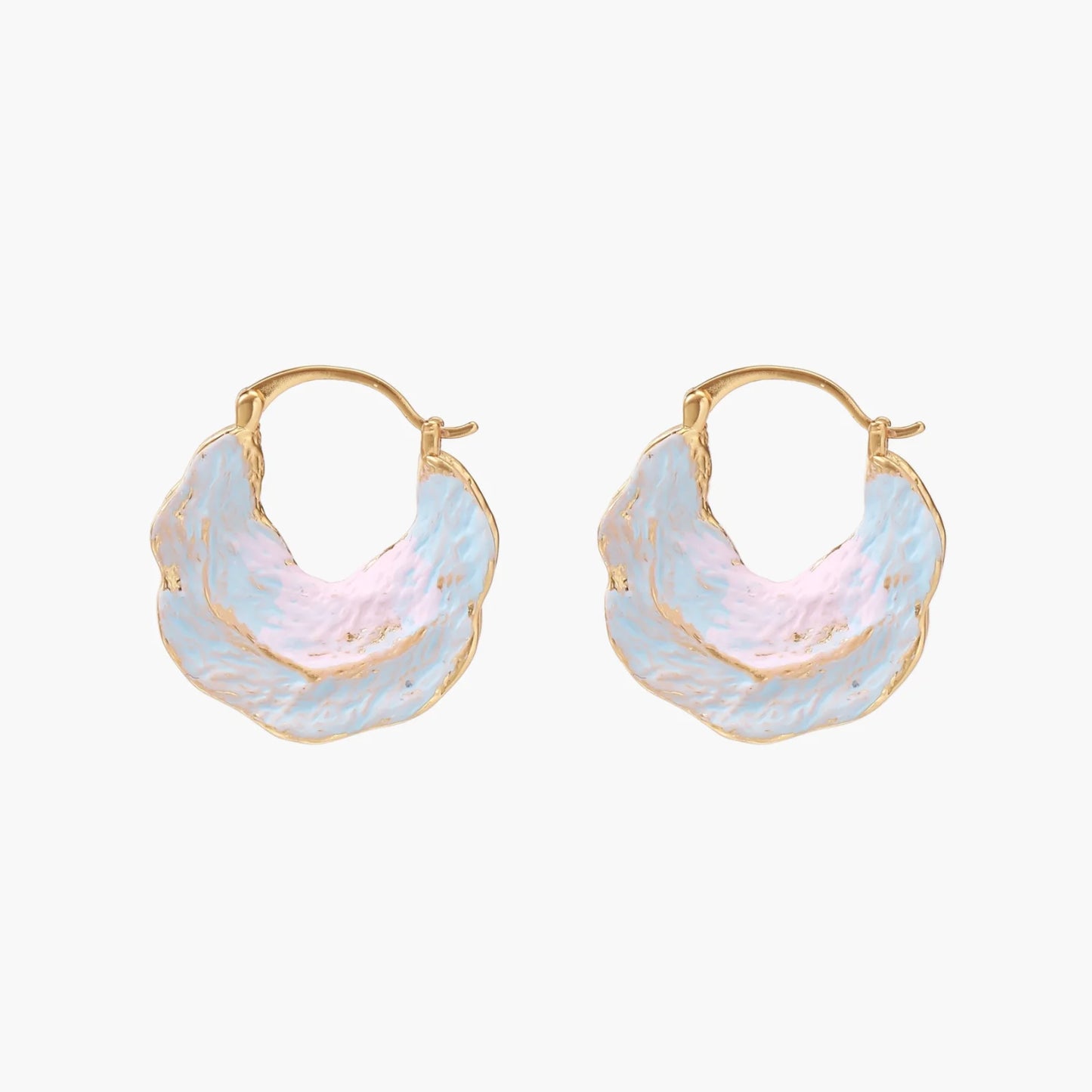 Shell-shaped hoop earrings with iridescent blue-pink enamel and gold trim on cream background