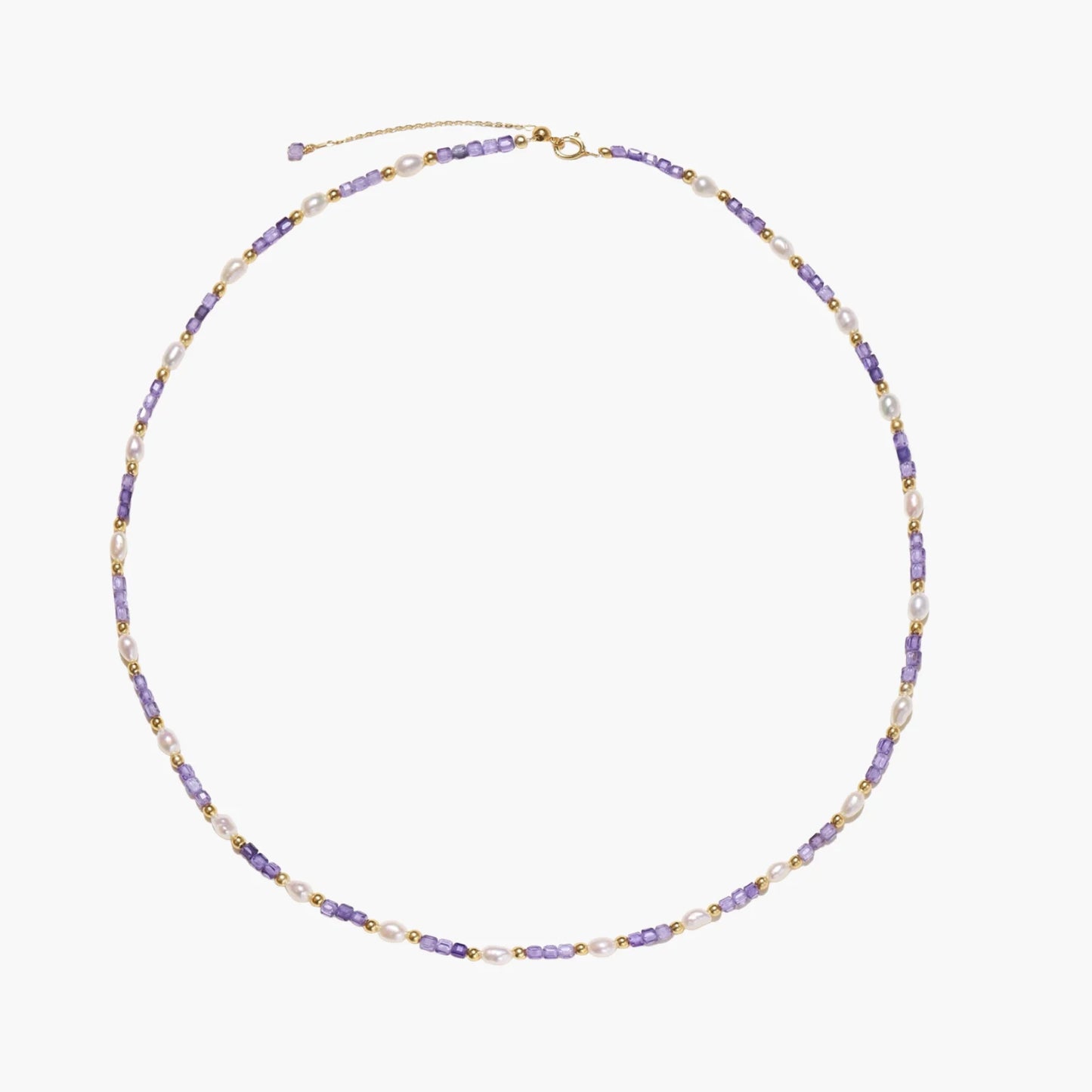 Delicate 18K gold vermeil necklace with alternating lavender zirconia beads and white freshwater pearls on cream background