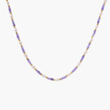 Delicate 18K gold vermeil necklace with alternating lavender zirconia beads and white freshwater pearls on cream background