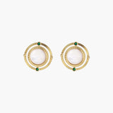Circular gold stud earrings with iridescent mother-of-pearl center and green zirconia accents on cream background.